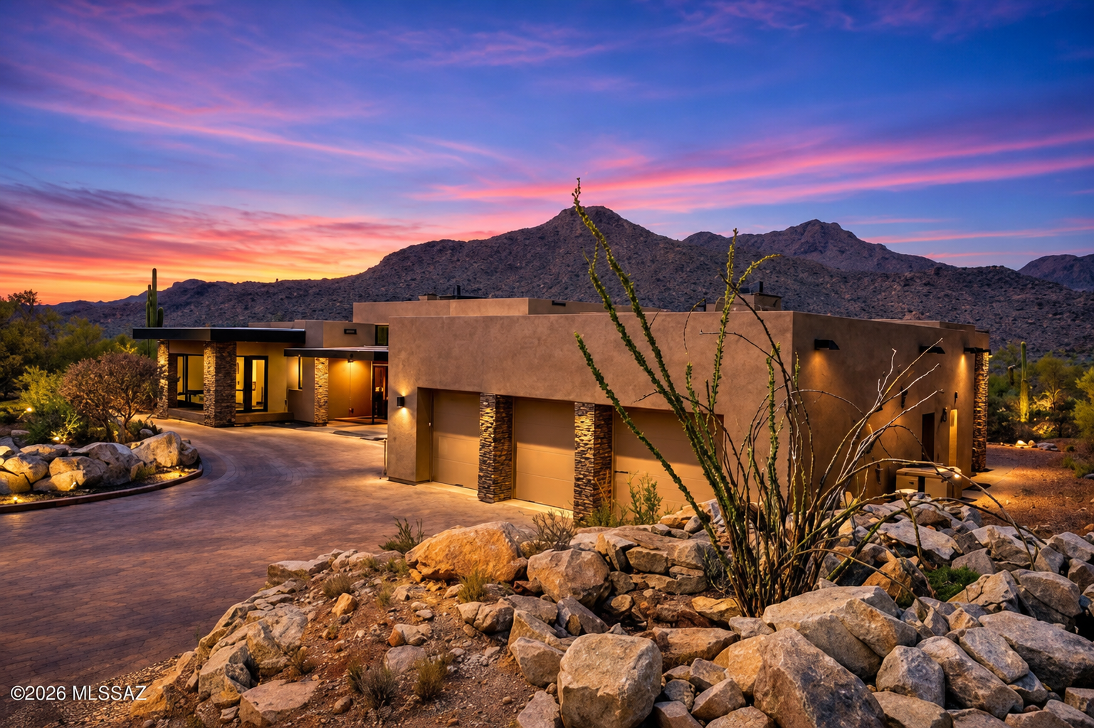 Macoyosh Builders — finished luxury home at sunset